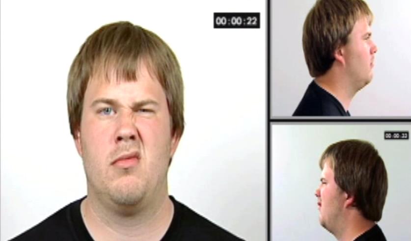 男人一邊眉毛跳起來的兇惡表情 男人一邊眉毛跳起來的兇惡表情